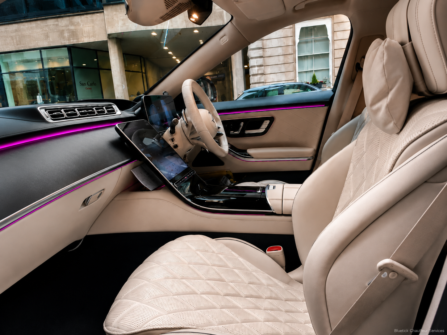 Mercedes S-Class cream leather front cabin with digital dashboard and ambient lighting for executive chauffeur travel