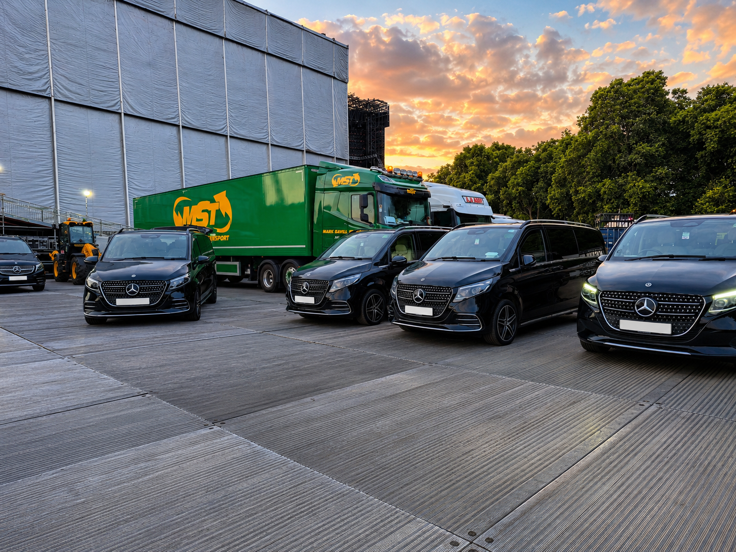 Multiple black Mercedes V-Class chauffeur vehicles positioned for coordinated event transport operations